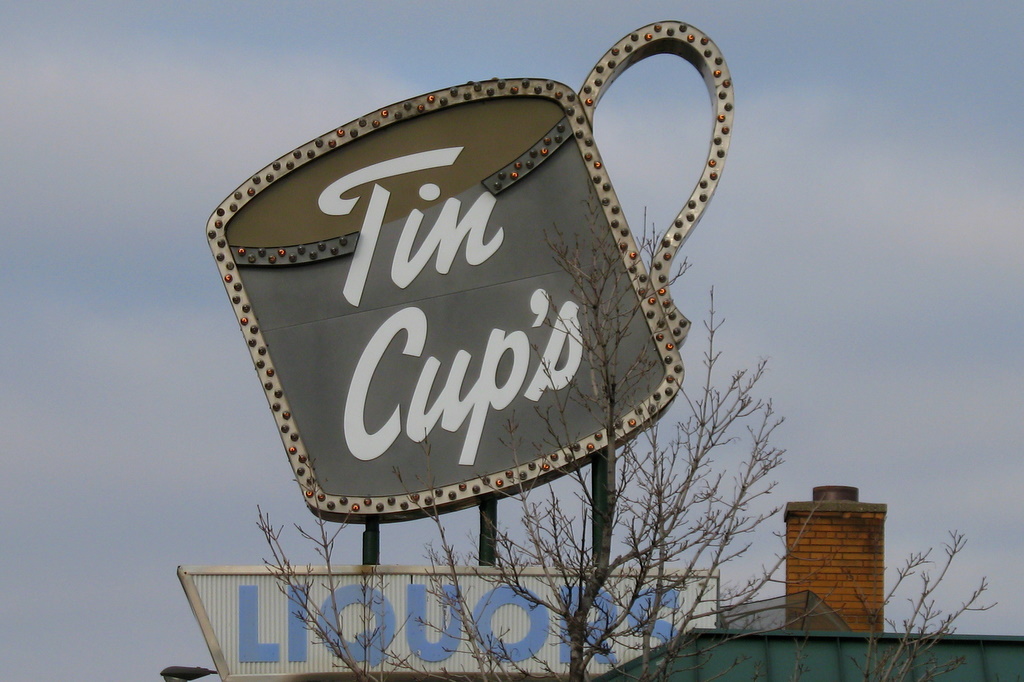 a business sign on Rice Street in St Paul reads Tin Cups.