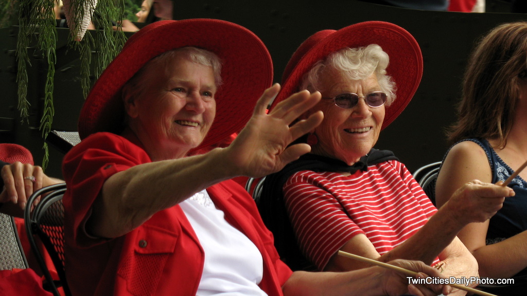 A couple of smiles from two ladies with red hats that were involved in the Afton, 4th of July parade. I captured them as they passed along the route.