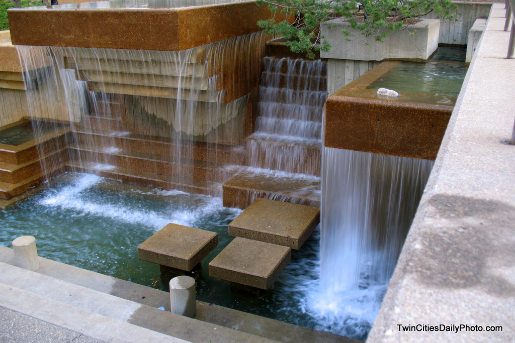 Just outside the door of Orchestra Hall, located in downtown Minneapolis is a park with plenty of water, pools, waterfalls, and artwork with water flowing out of them.