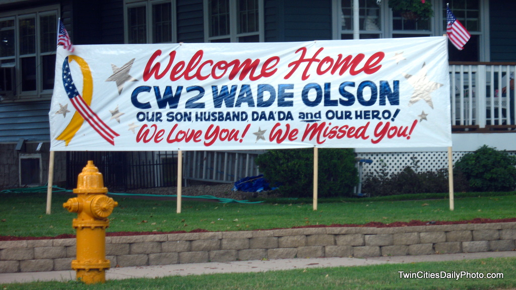 A sign welcoming home a soldier from the war.