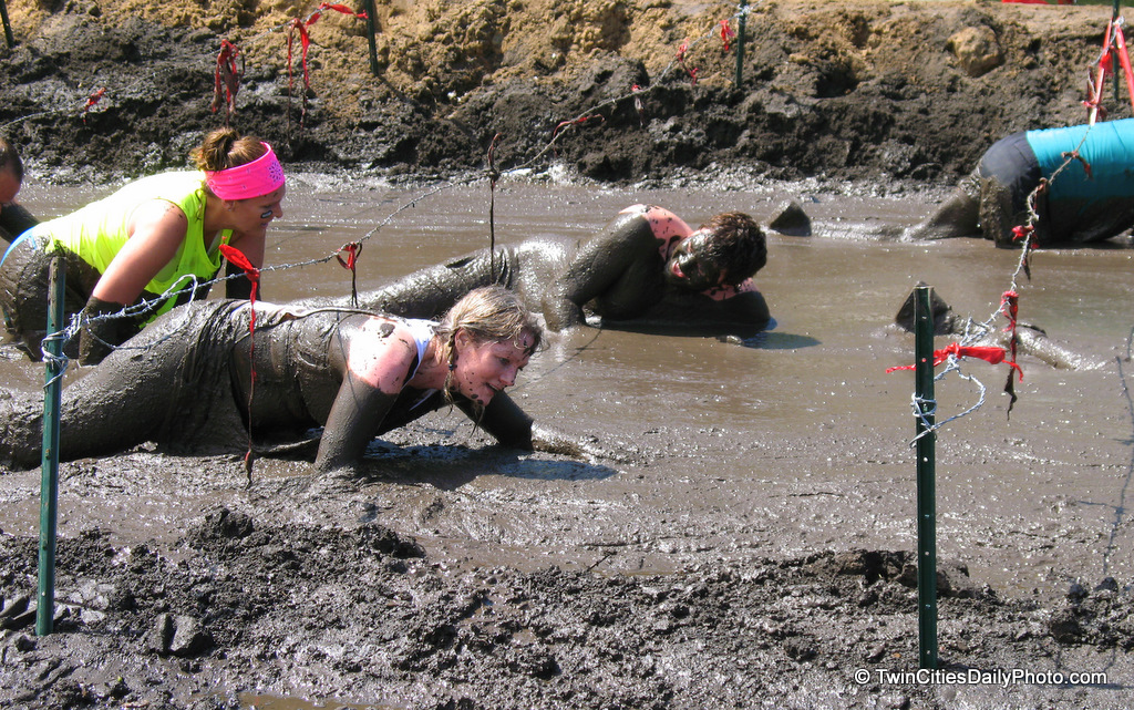 Crawling through the mud at the Warrior Dash was the final obstacle each participant had to endure. Having crawled through the mud myself, watching others do the same made it much more enjoyable.