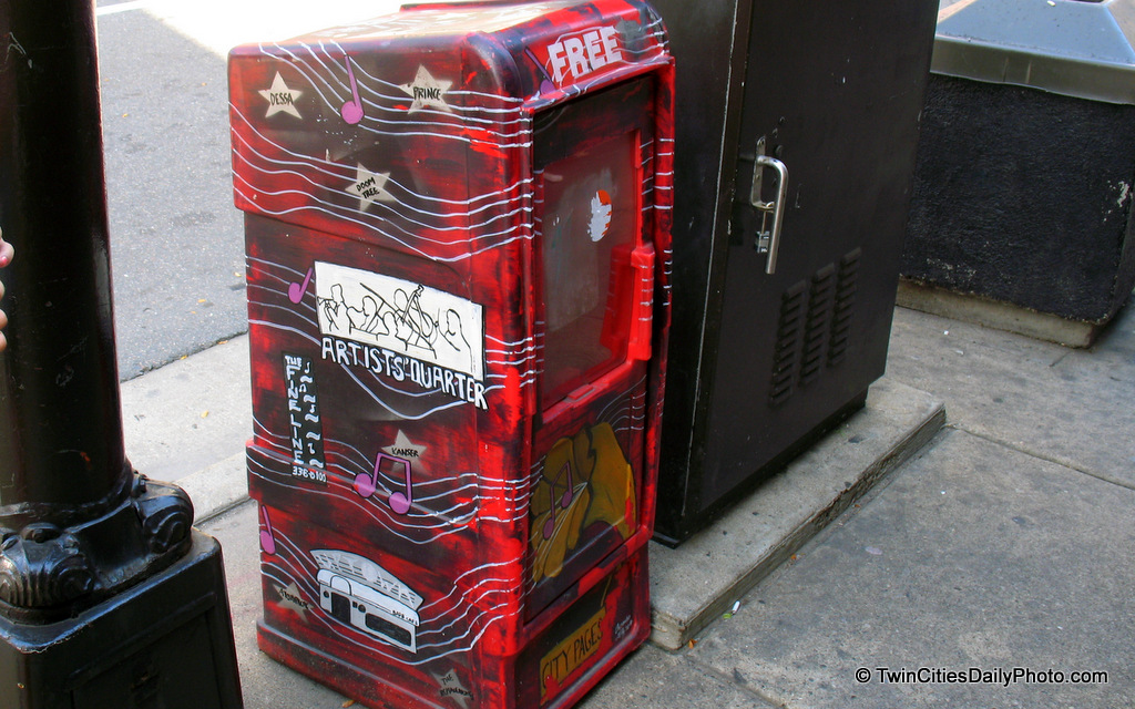 It was empty when I photographed it, but this hand painted newspaper box sits outside the First Avenue night club.